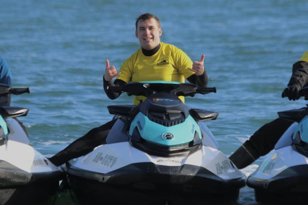 Person enjoying a jet ski tour on the South Coast waters.