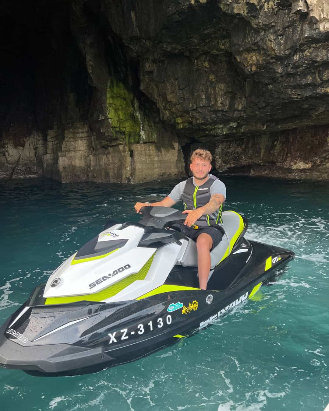Jet ski riding adventure at South Coast Marine, exploring scenic coastal caves and waters.