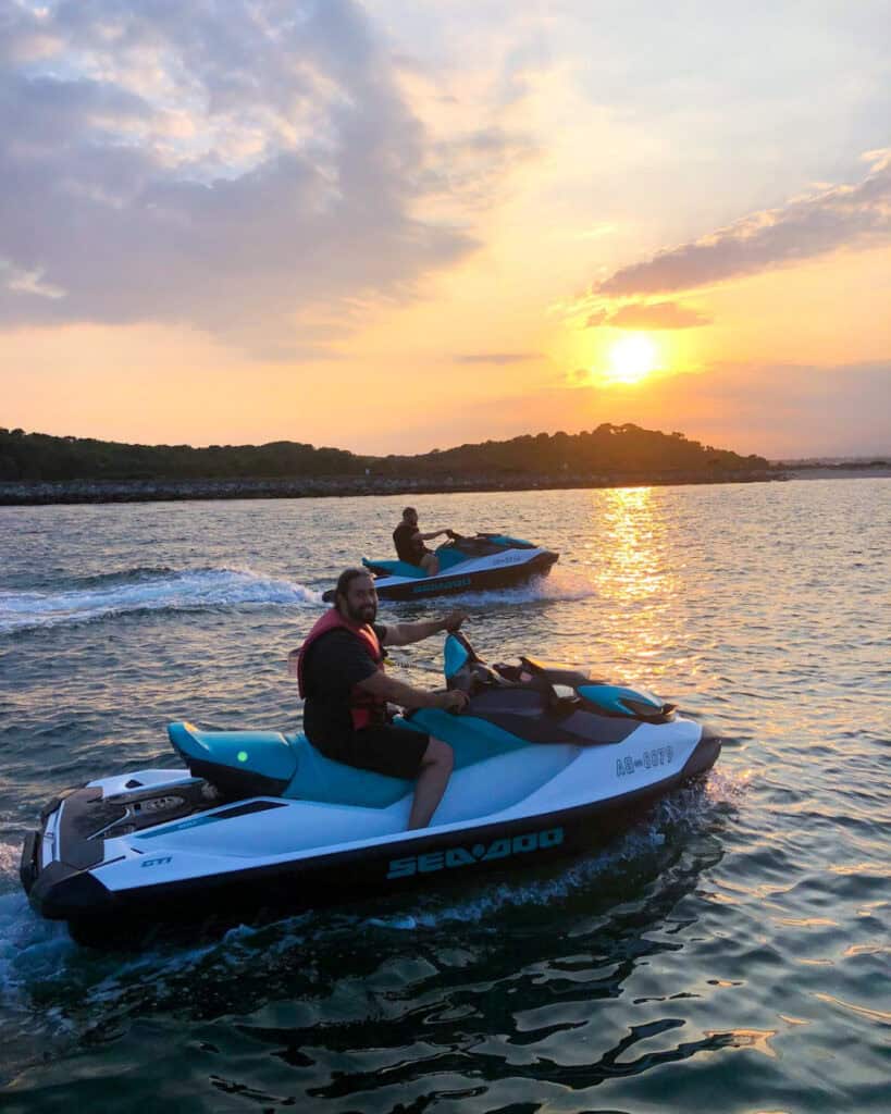 Jet Ski tours on South Coast waters during sunset.