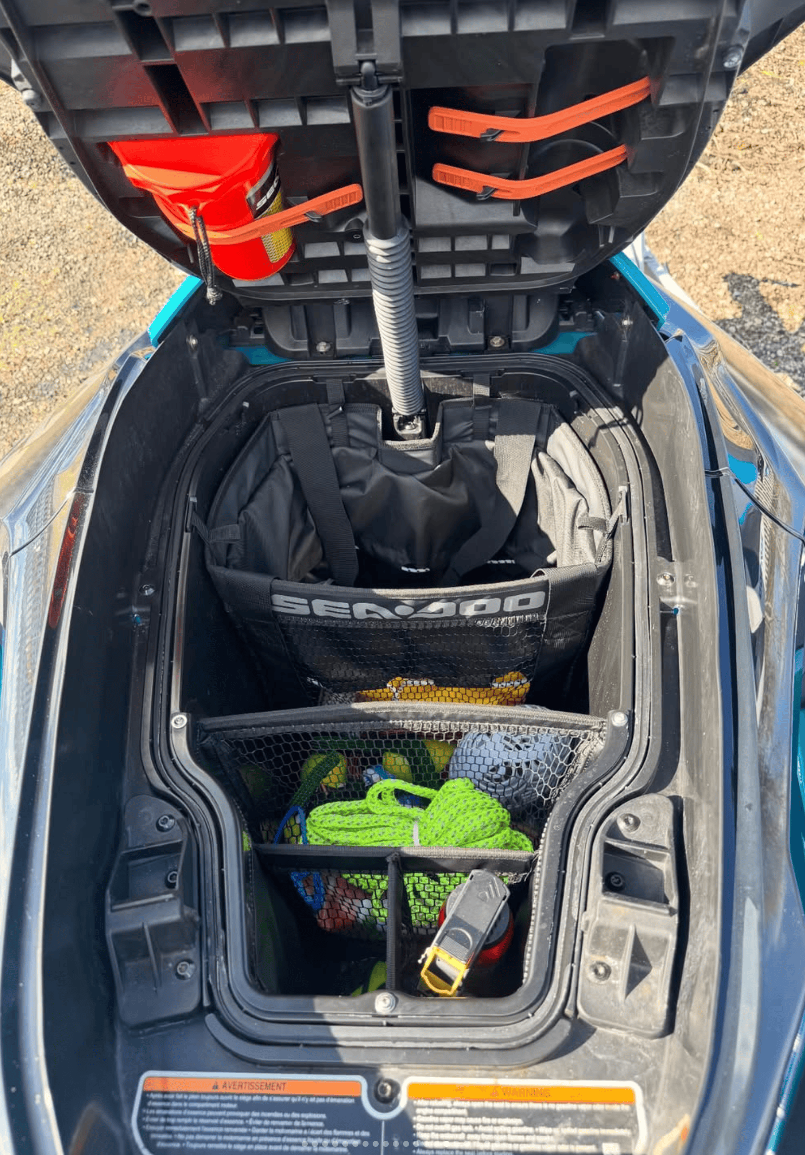 Jet Ski storage with safety gear and accessories for marine adventures.