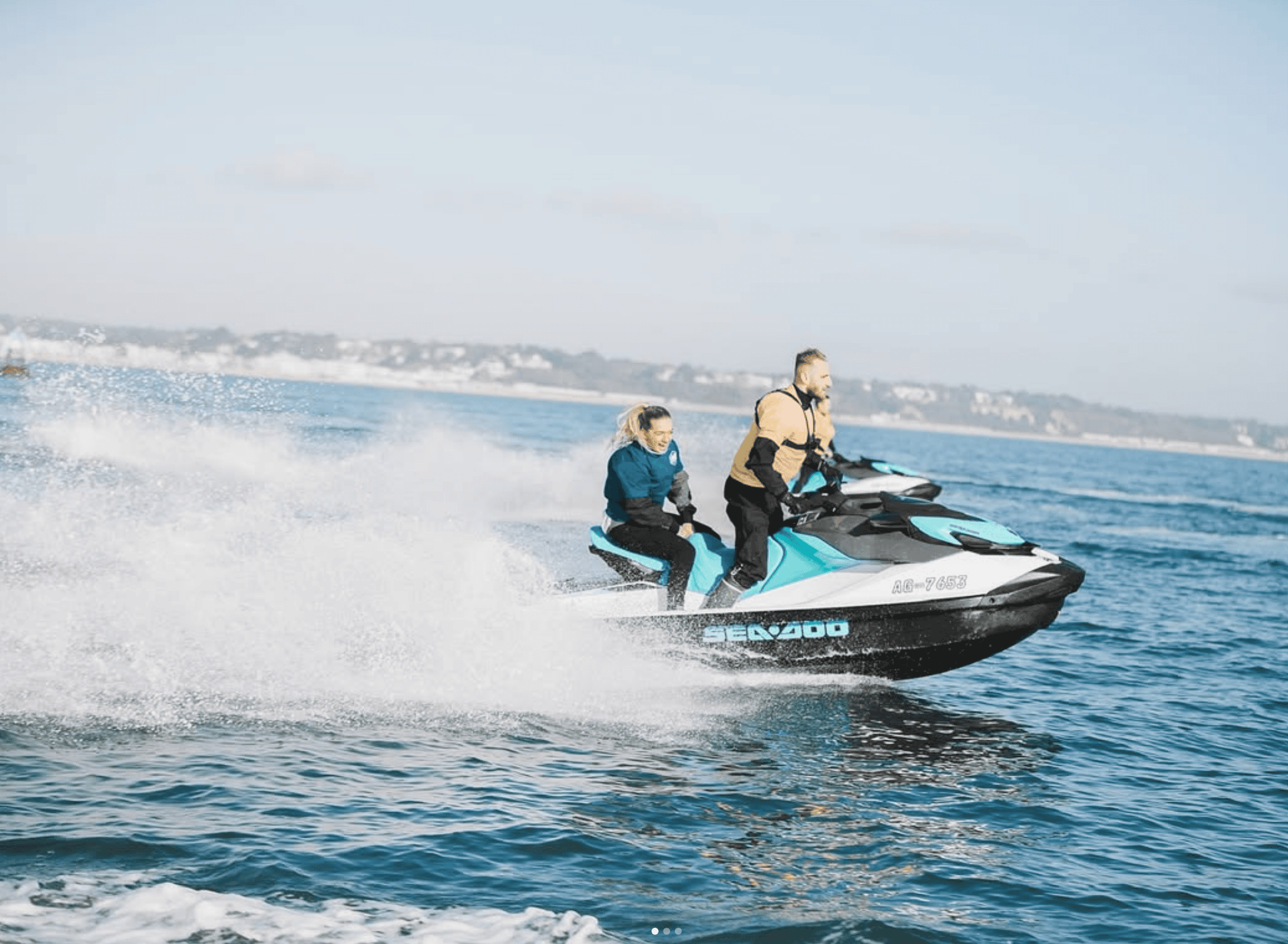 Two people riding a jet ski on the ocean during a marine adventure.