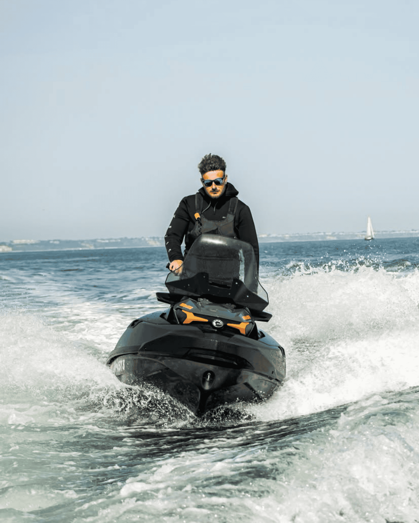 Man riding a jet ski on the water during a South Coast Marine tour.